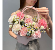 Dianthus and daisies in a handbag